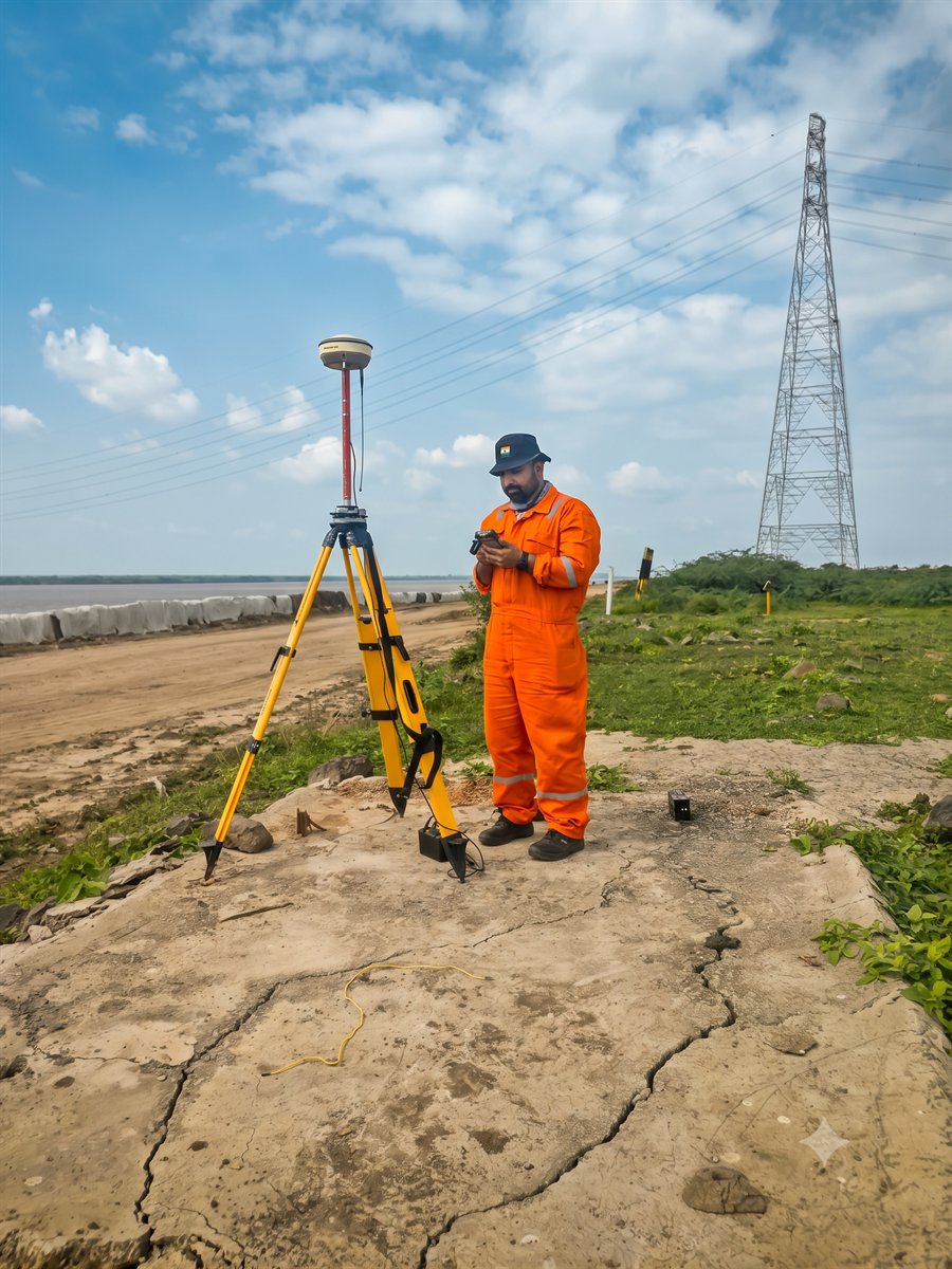 OSS surveyor with a GNSS receiver on a GAIL project site in Gujarat